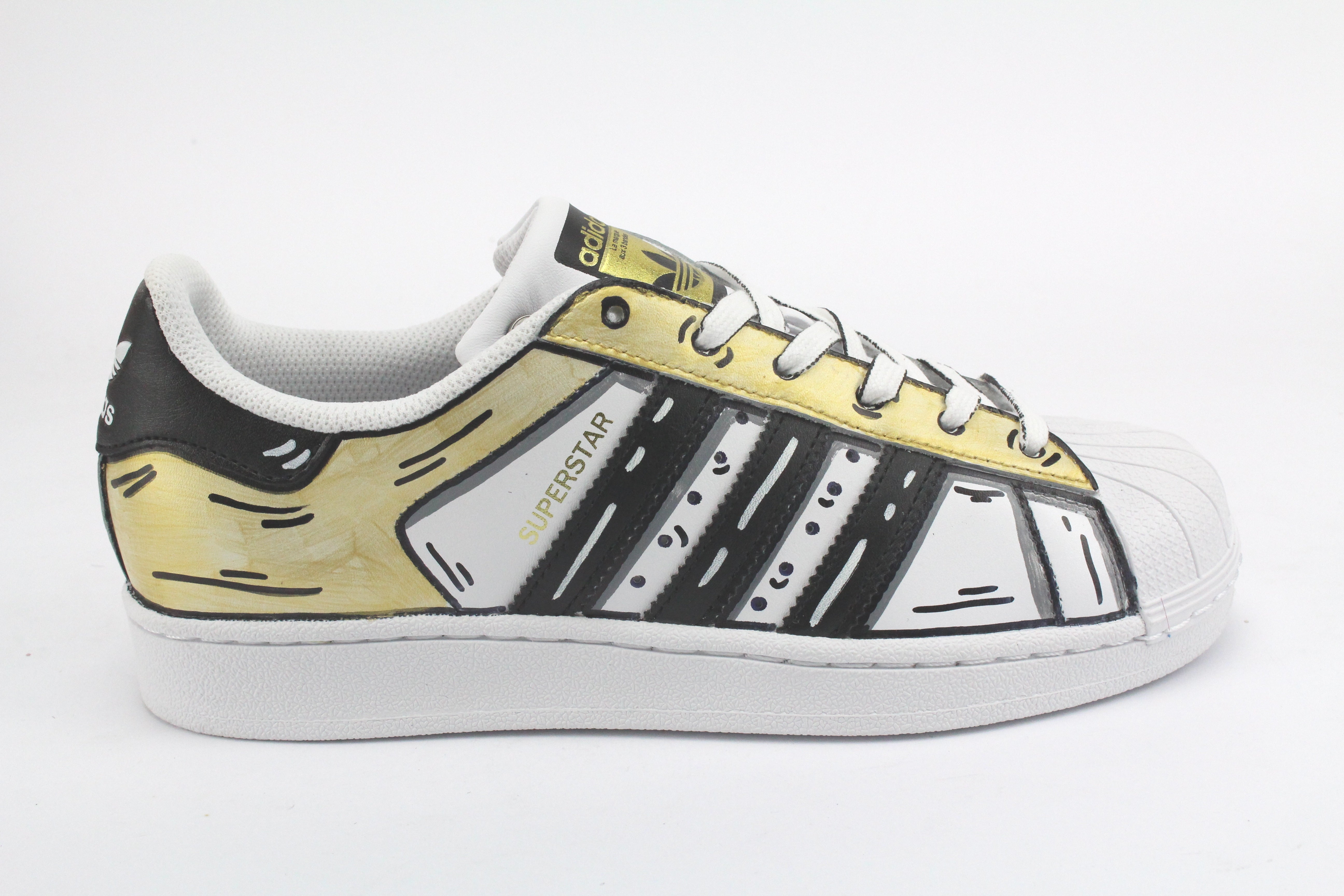 Adidas Superstar Cartoon Gold and cartoon laces